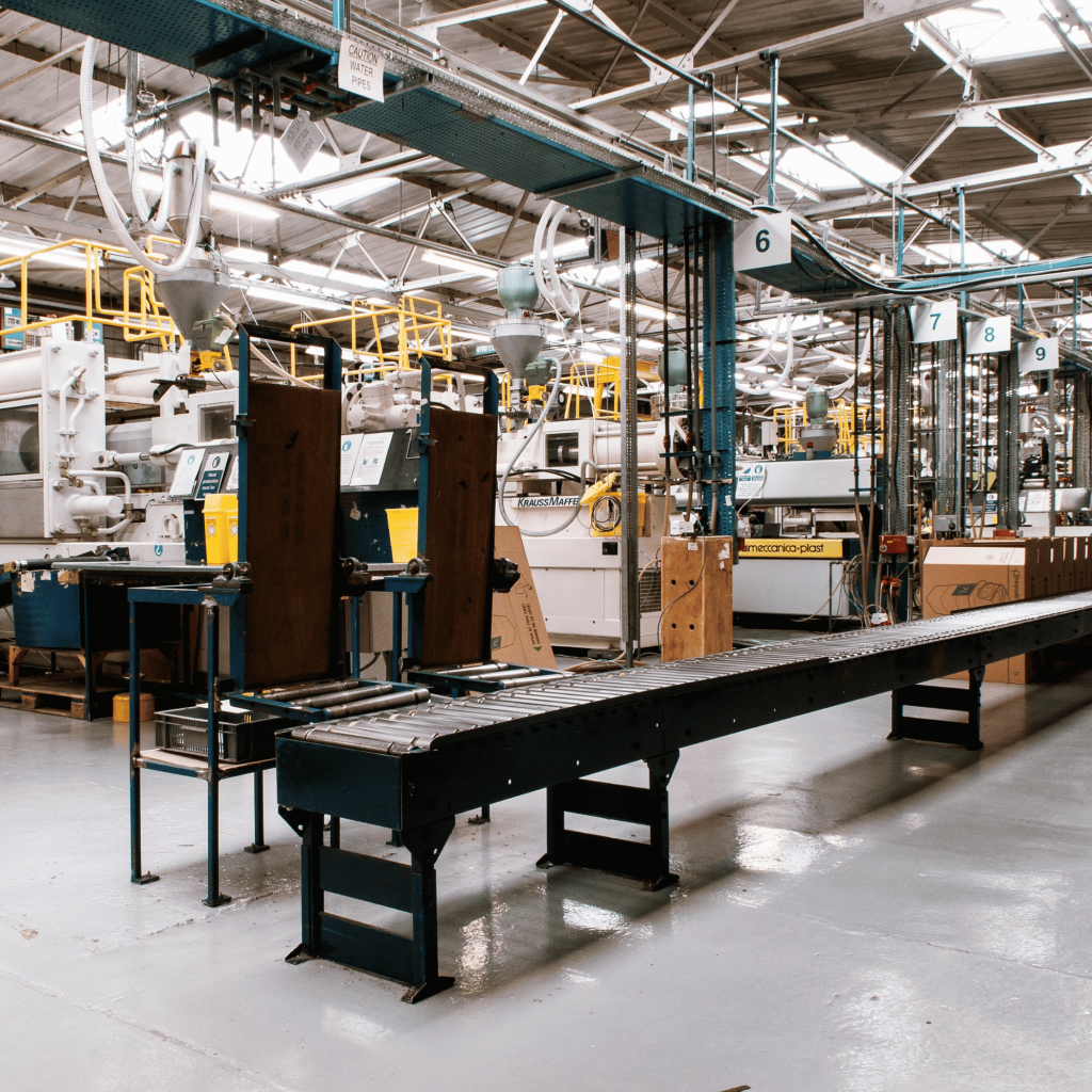 Plastic molding operator scanning materials for resin-to-shipment traceability with manufacturing software.