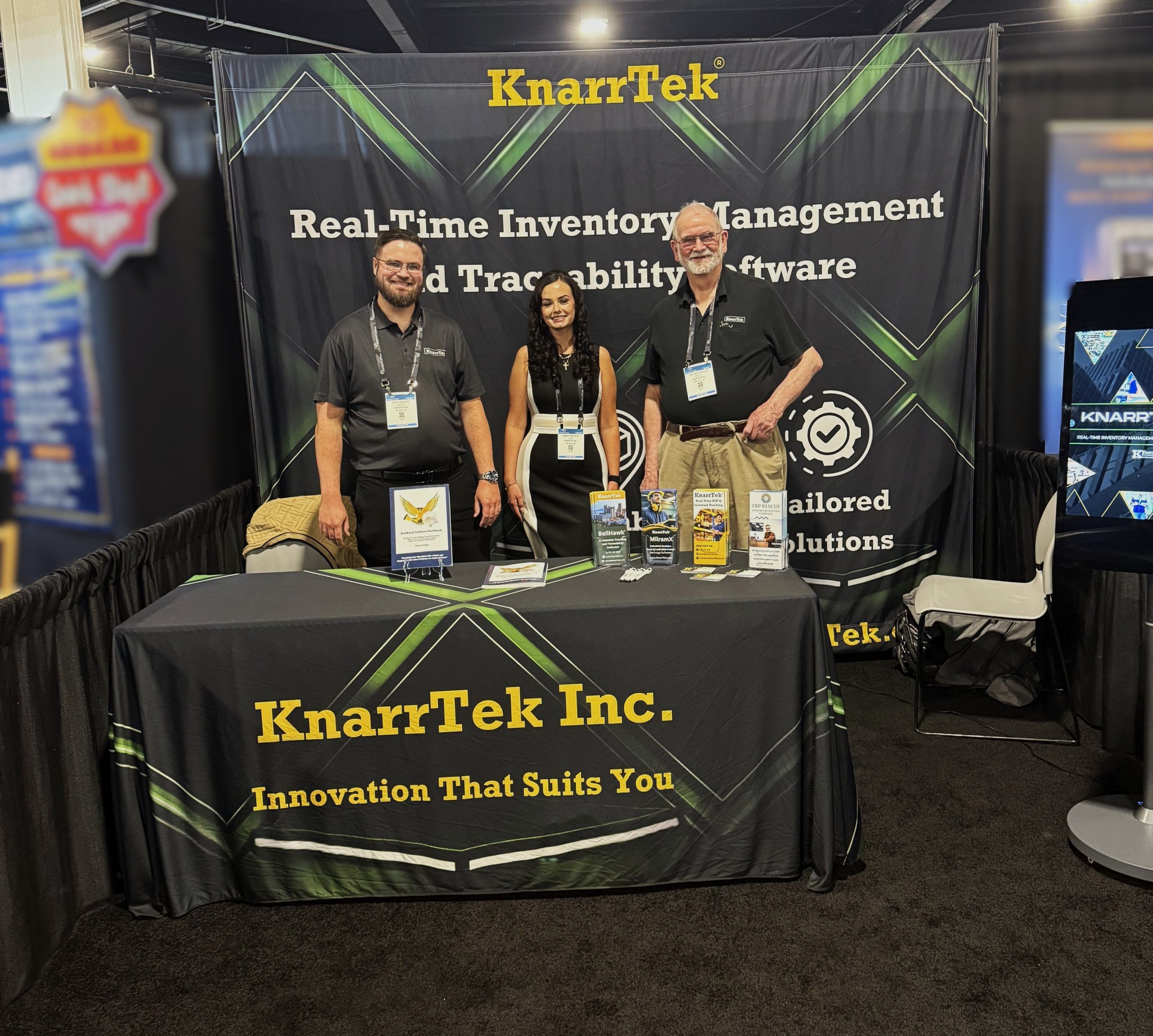 KnarrTek team at a manufacturing tradeshow discussing inventory tracking software, WIP tracking software, barcode tracking, RFID tracking, materials traceability, and manufacturing tracking software